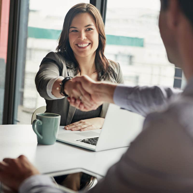 business people shaking hands during job interview