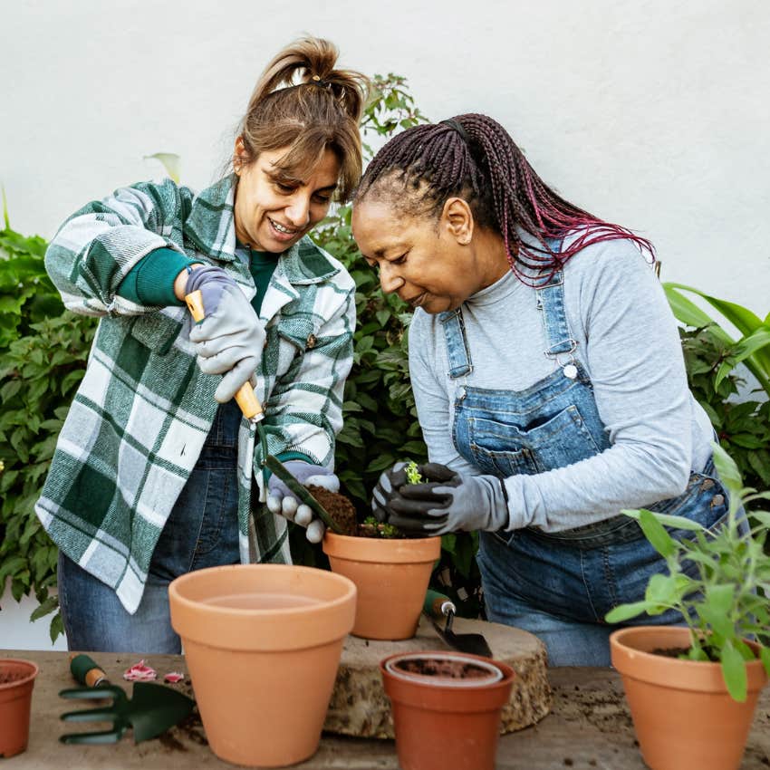 Two women gardening together. 