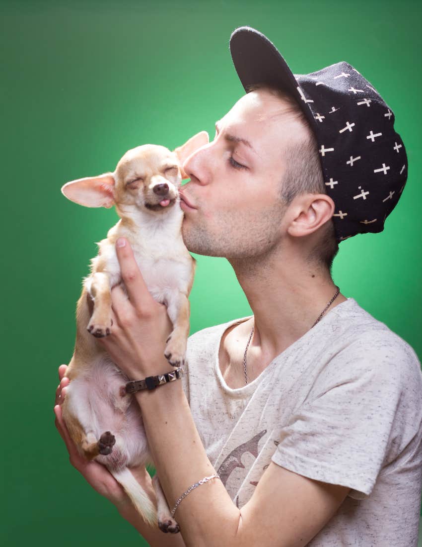 man kissing a dog