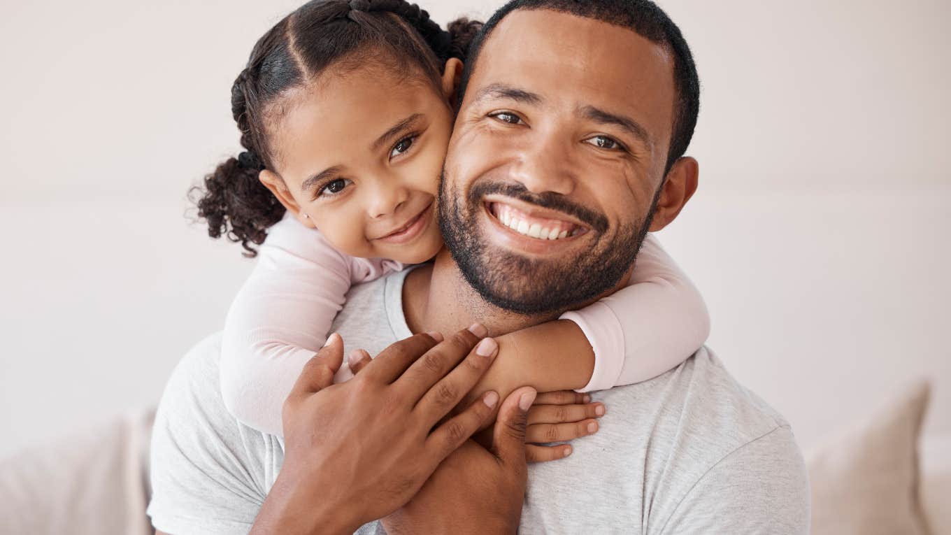 little girl hugging her dad