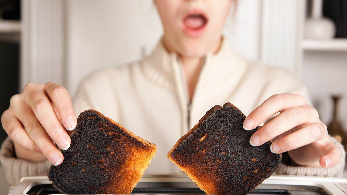 woman gasps at her burnt toast