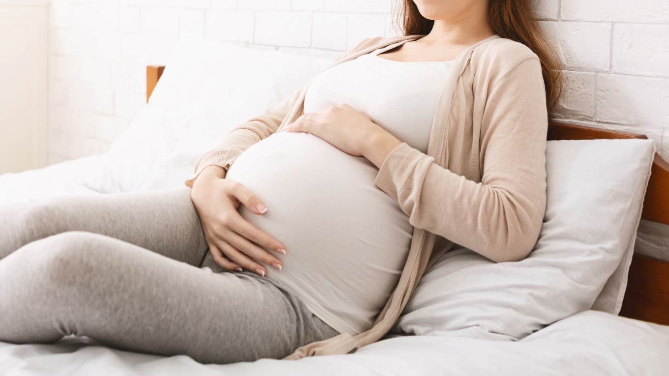 pregnant woman resting in bed