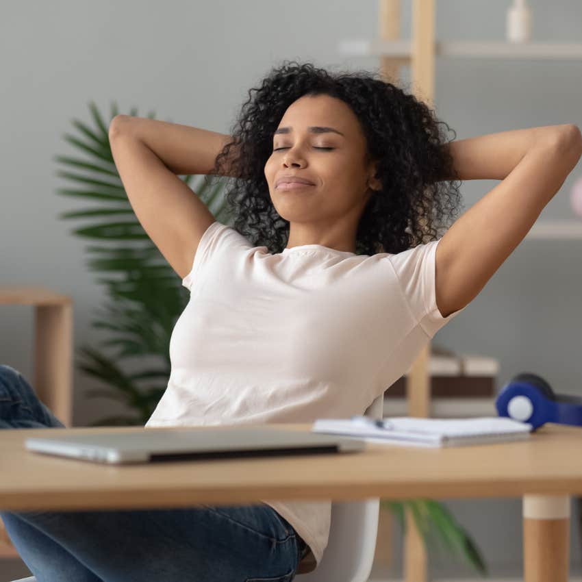 Successful worker resting at her desk. 