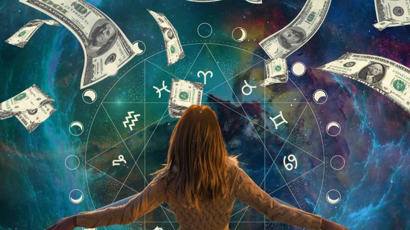 Woman celebrating financial abundance from the Universe