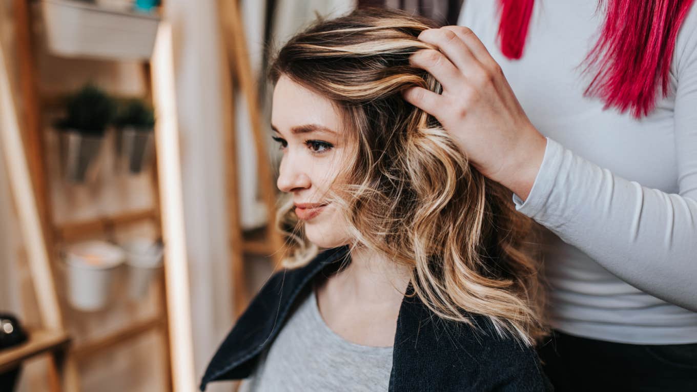 woman getting hair done at the salon