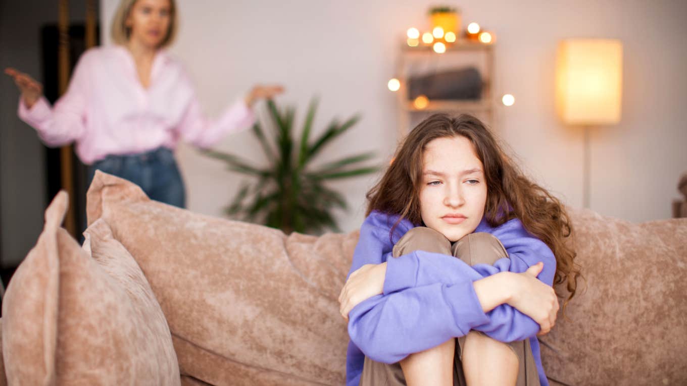 teenage girl being scolded by mom at home