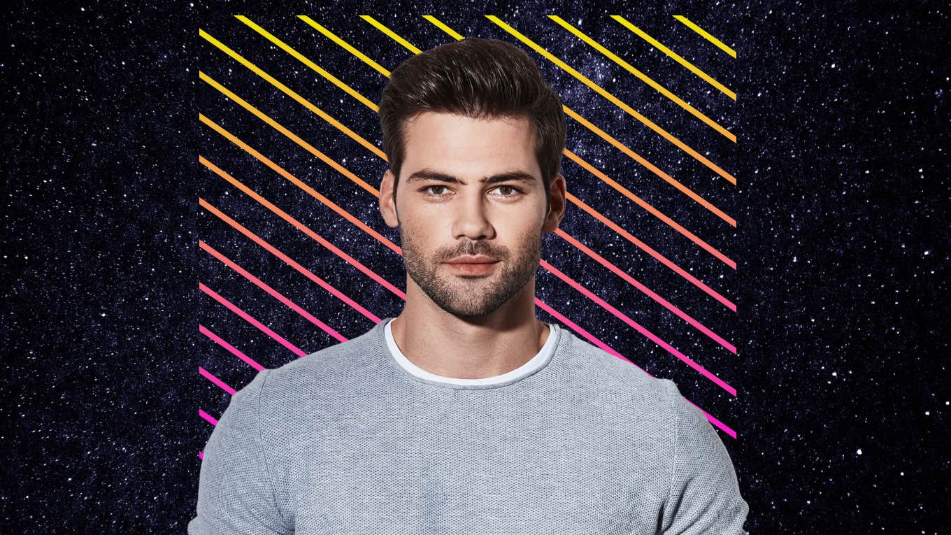 Manipulative handsome man looking in camera in front of colorful background