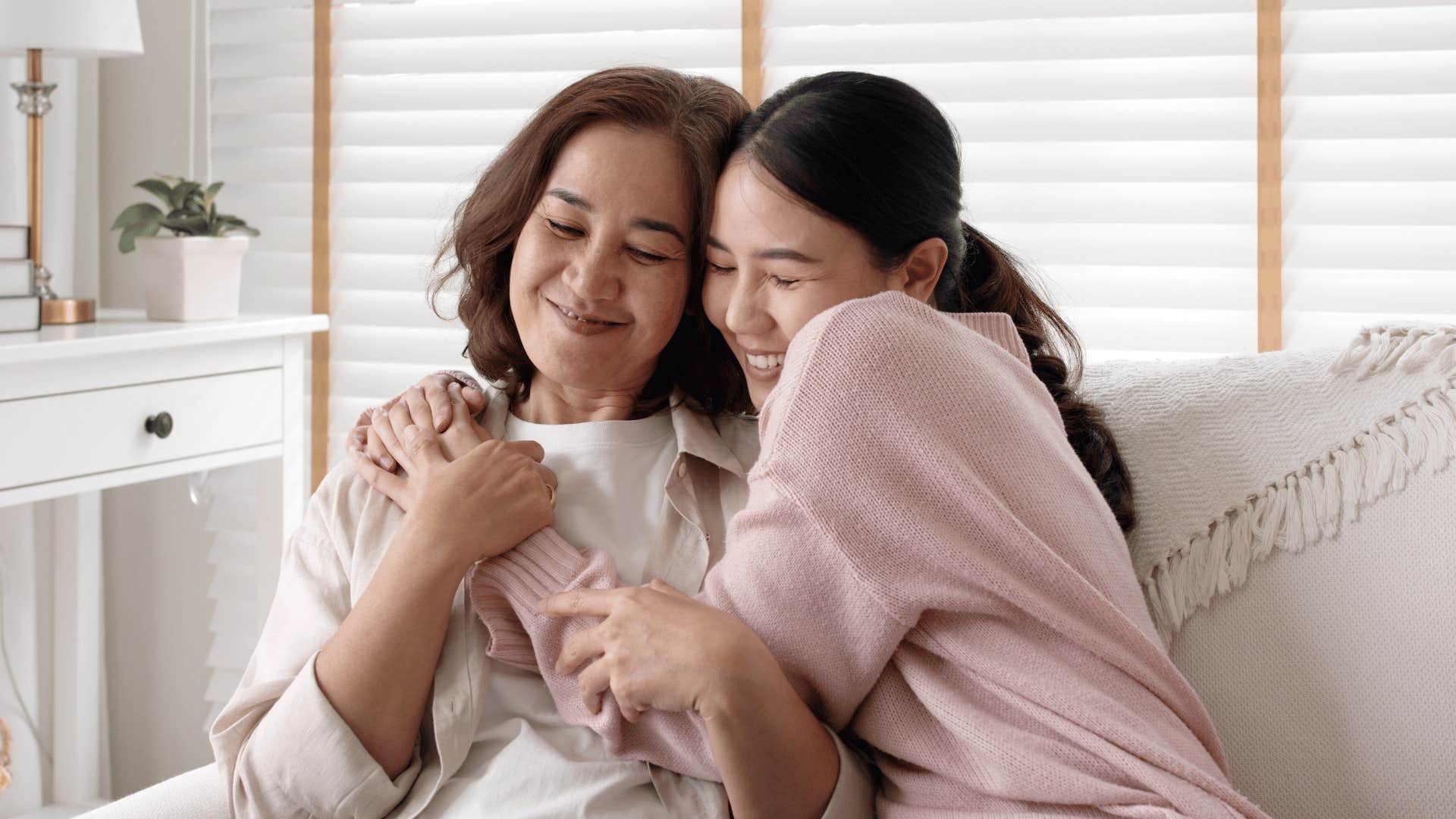 classy daughter and mom hugging