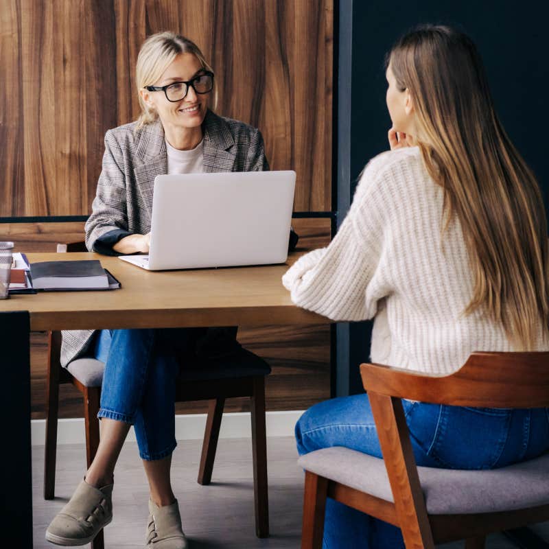 Woman professional HR interviews a candidate for a vacancy