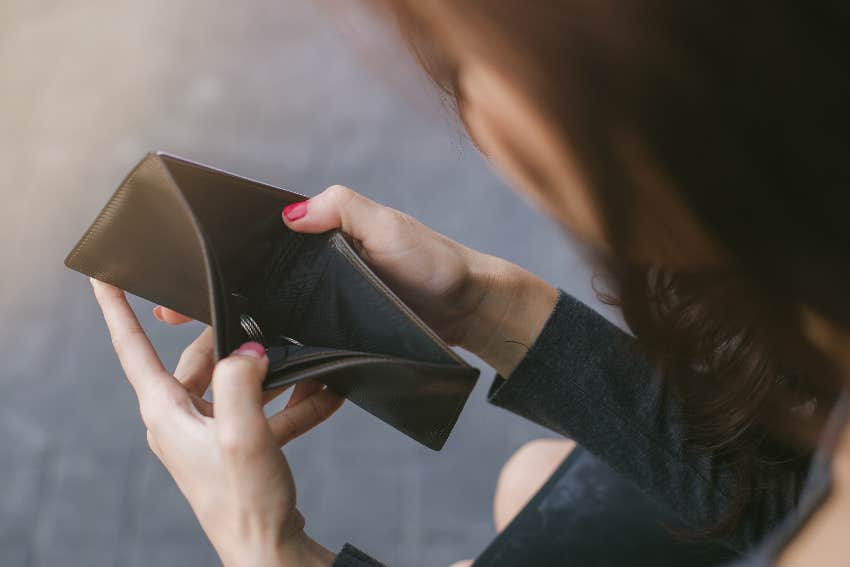 woman whose marriage ended opening empty wallet