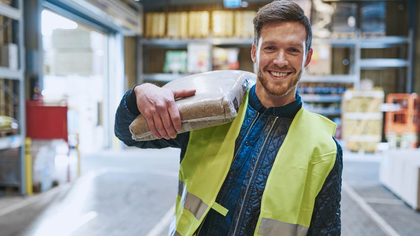 construction worker with a bag on his shoulder