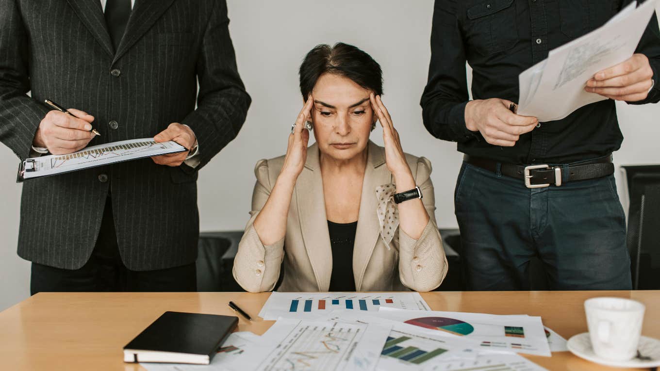 Woman stressed out at corporate job