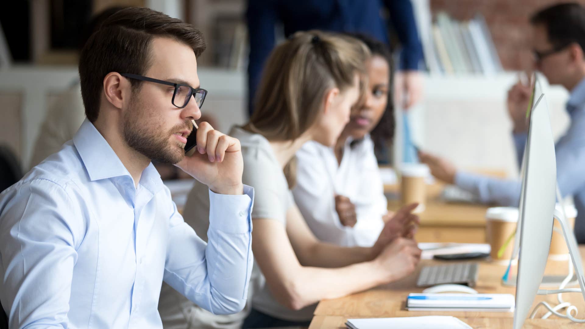 man on phone in office 