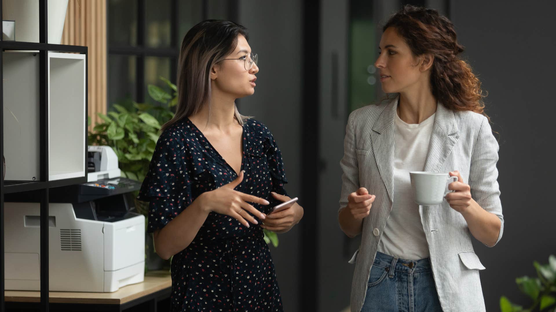 two women talking at work 