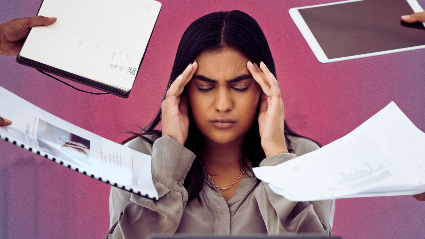 Stressed woman surrounded by work needs to follow critical steps to recover from her extreme burnout.