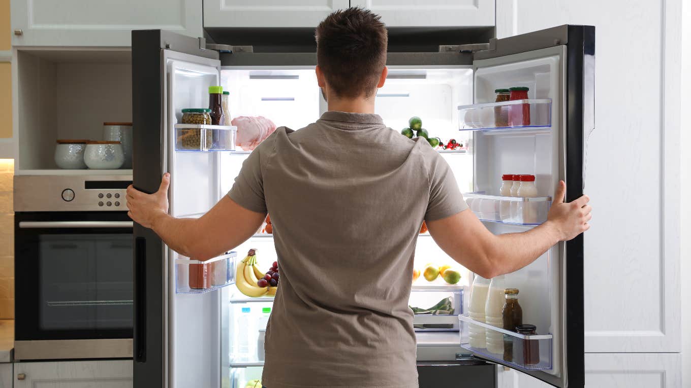 Man looking in fridge