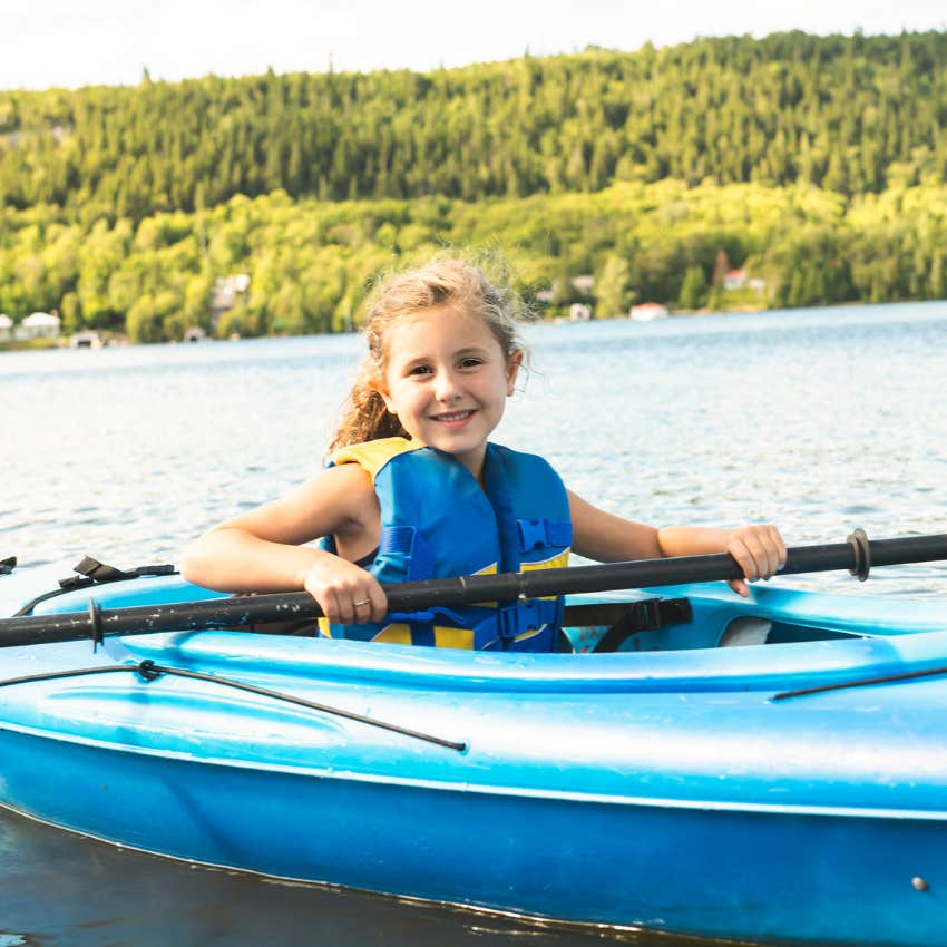 girl in a kayak on a lake