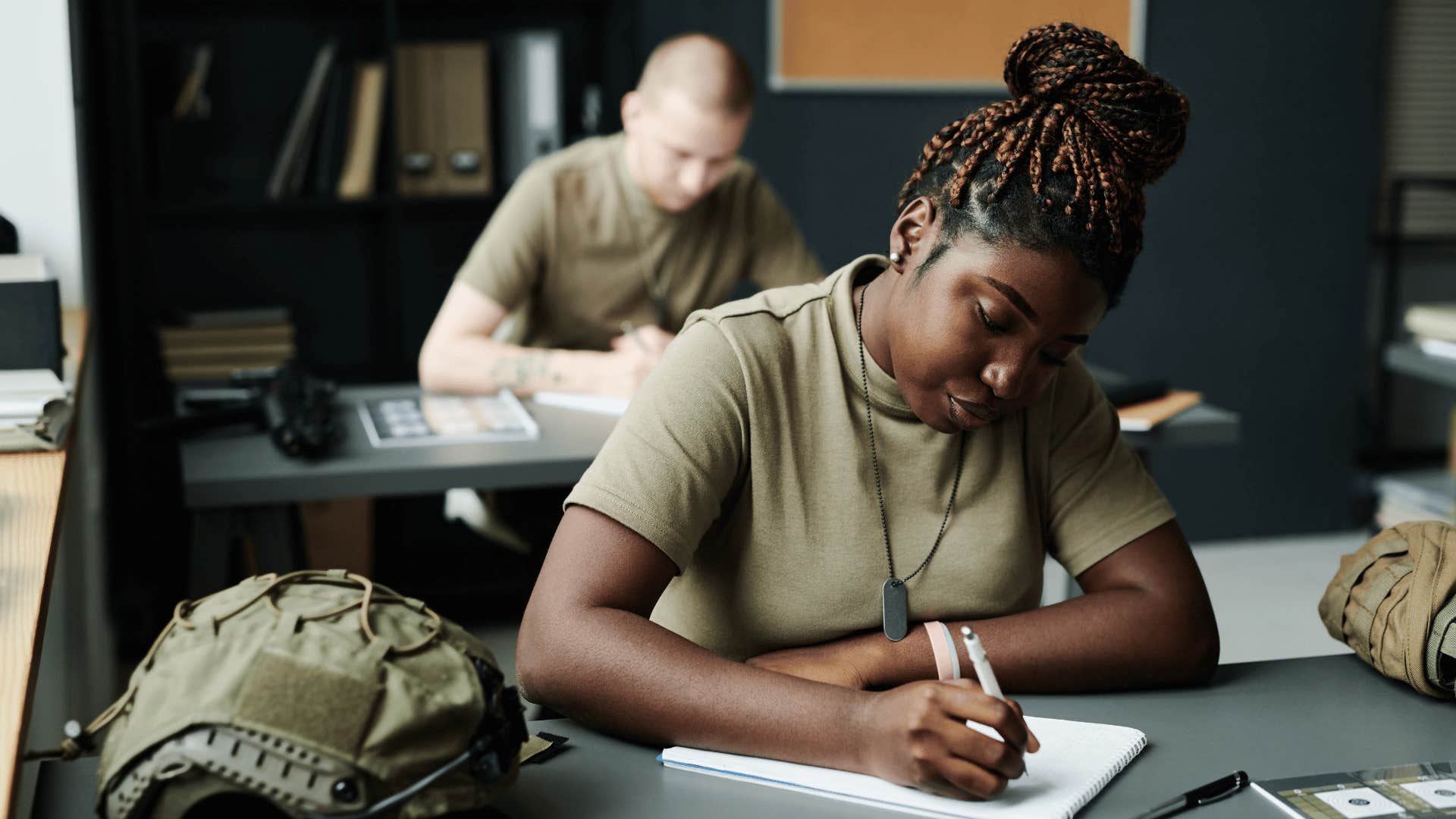 brown collar military student working on test