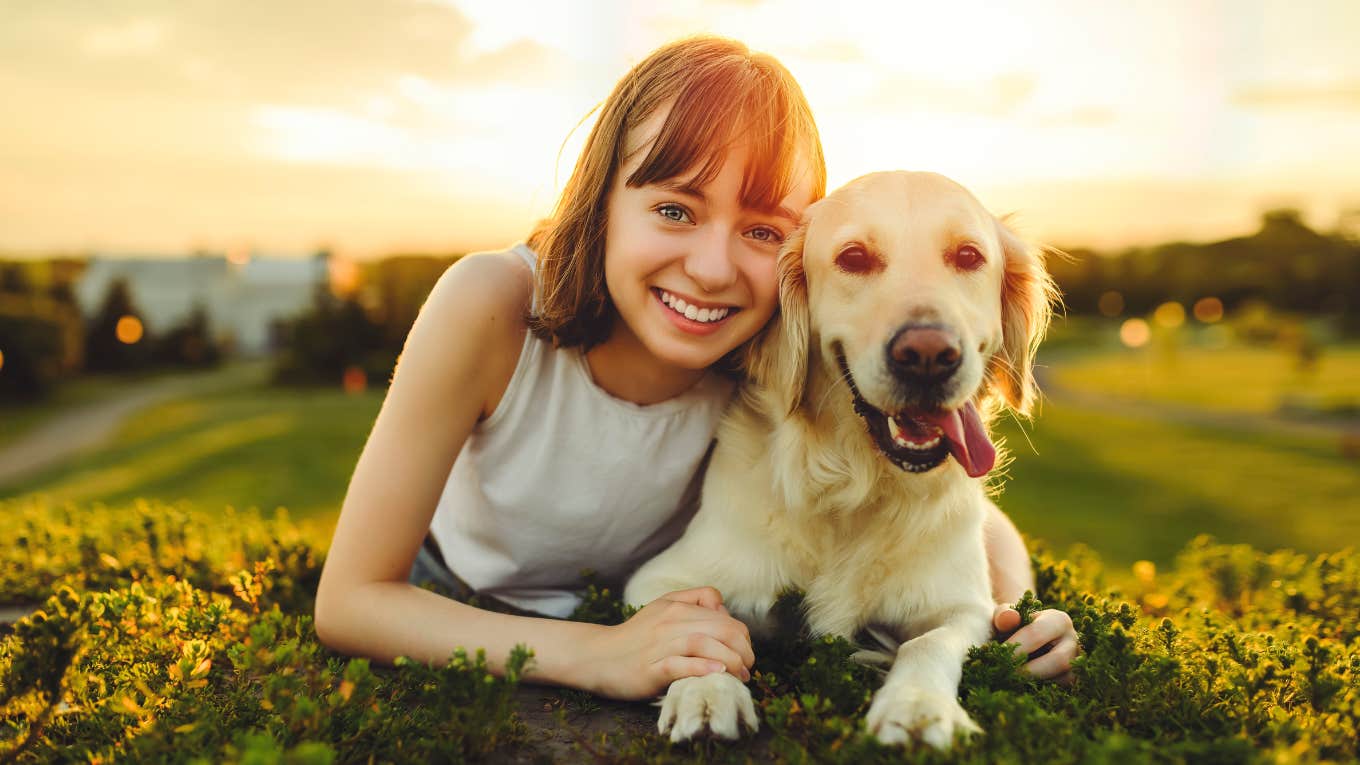 woman laying next to loyal dog