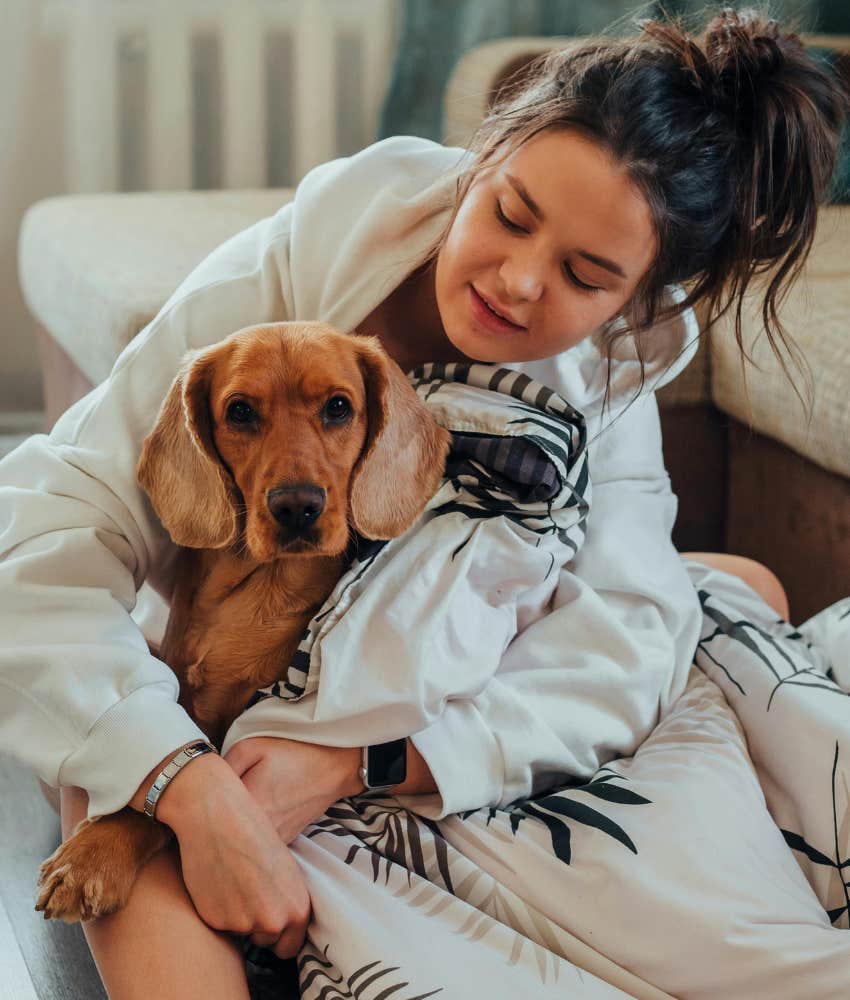 woman hugging a dog 