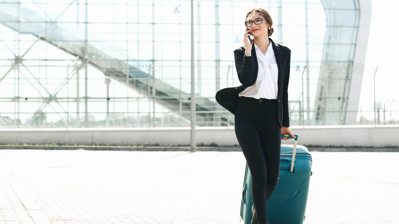 woman on the phone at airport