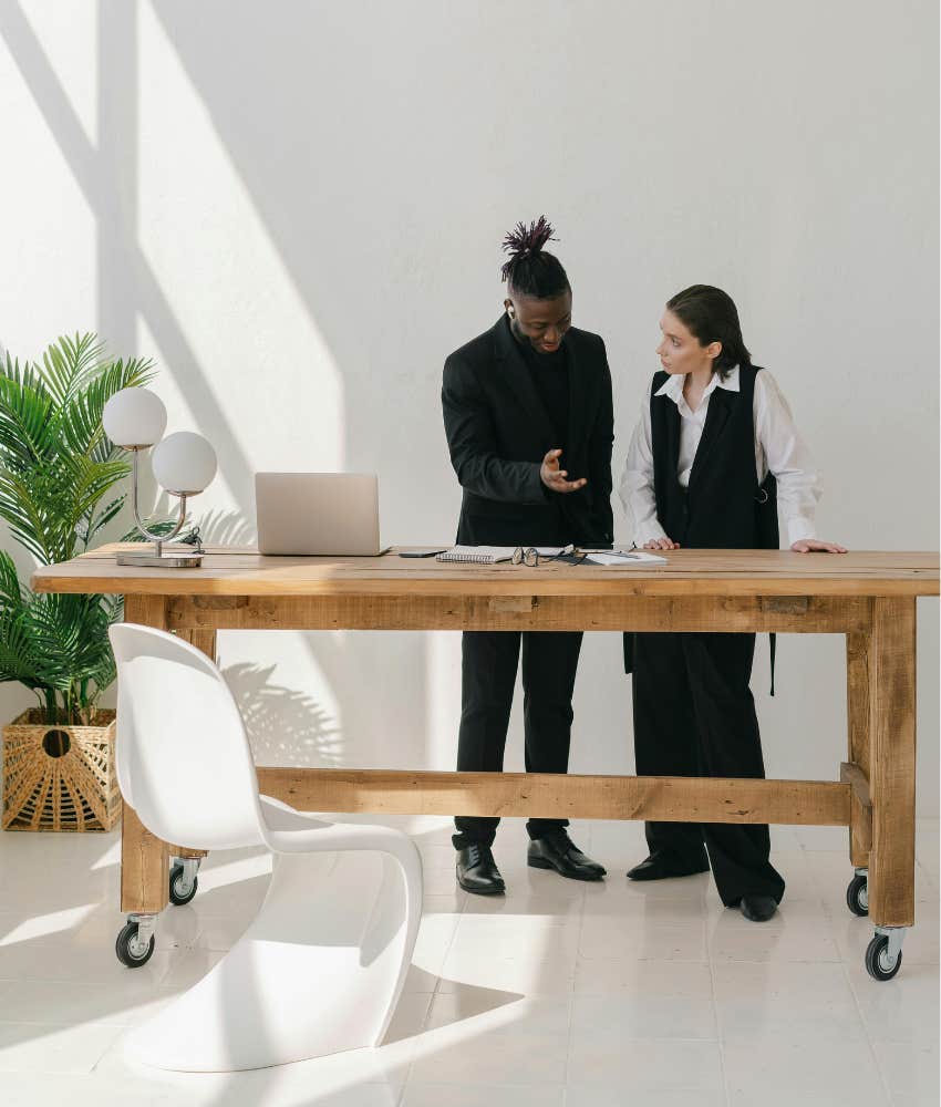 two people in an office talking