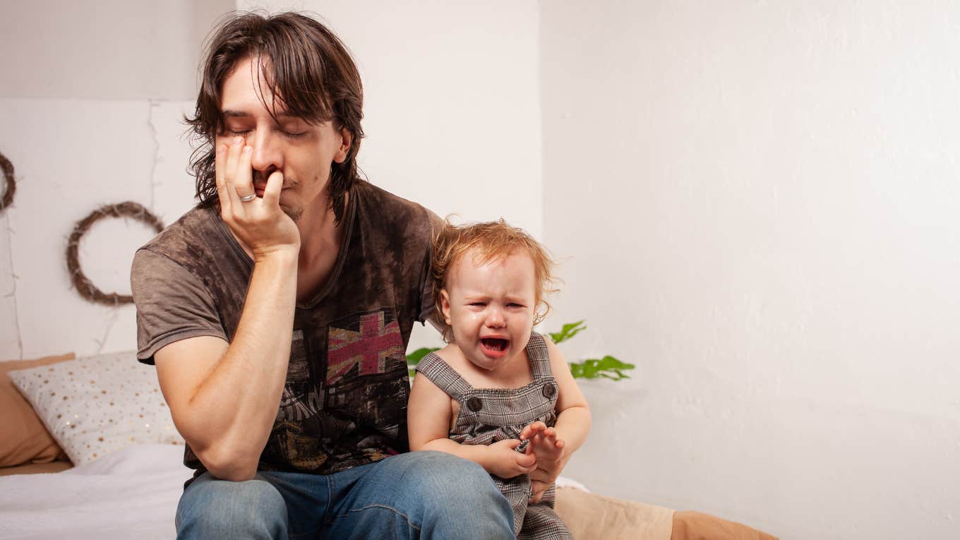 dad with crying baby