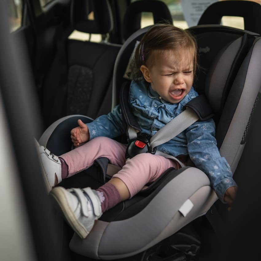 crying toddler in a carseat 