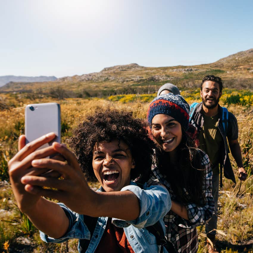 friends taking a picture together while on a hike