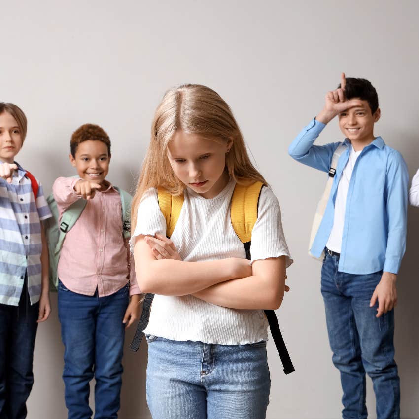 Girl being bullied by boys