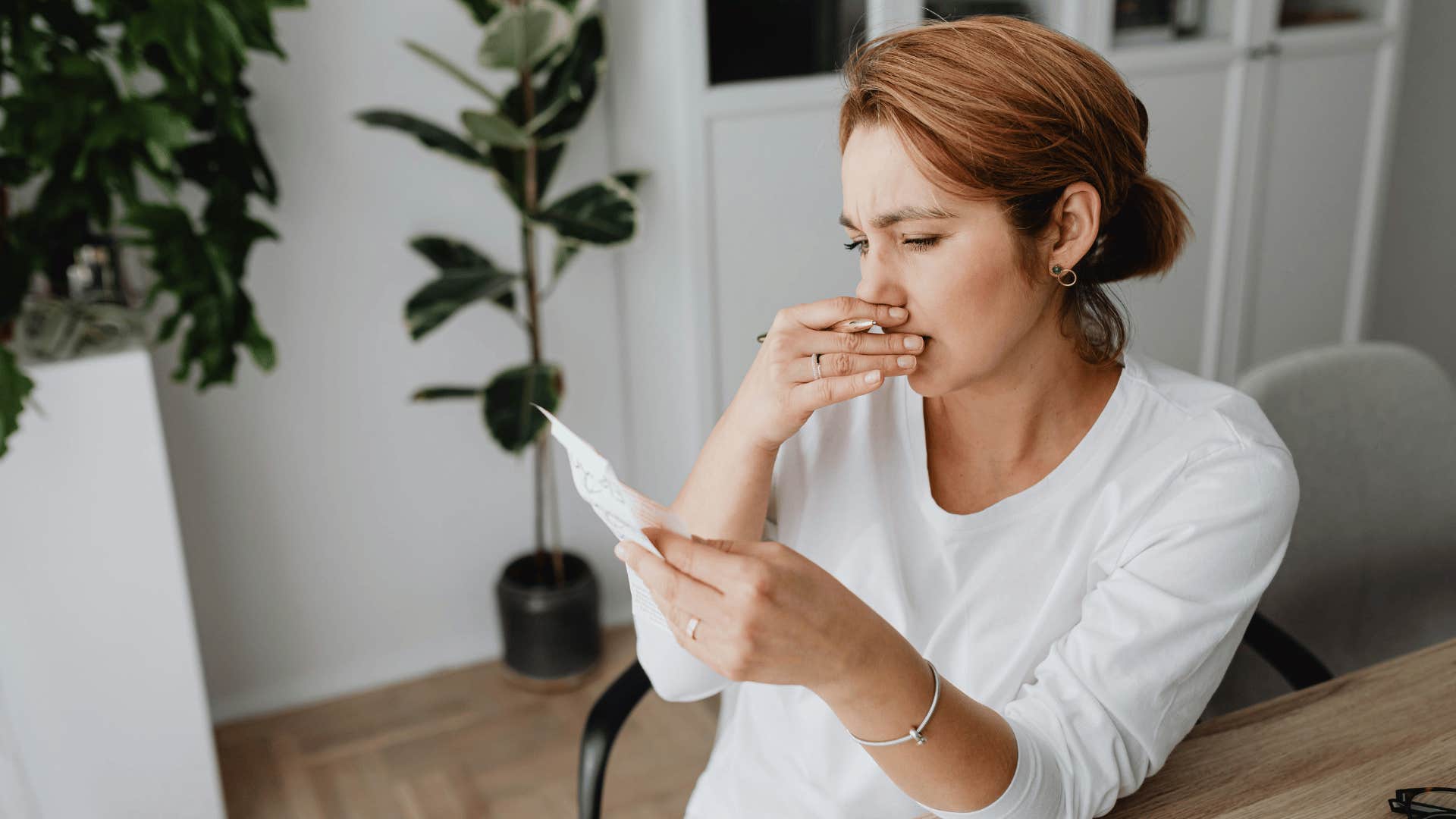 productive woman looking at list