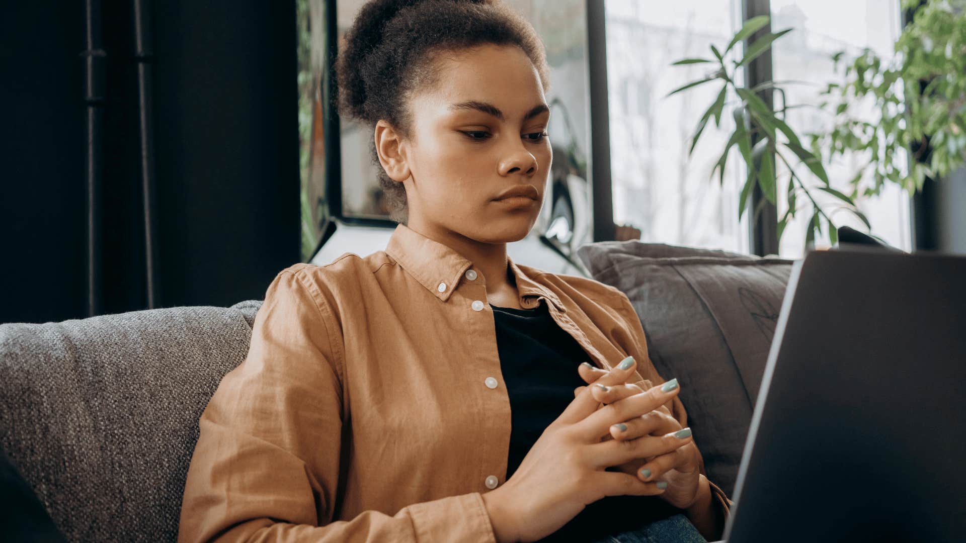 productive woman looking at computer