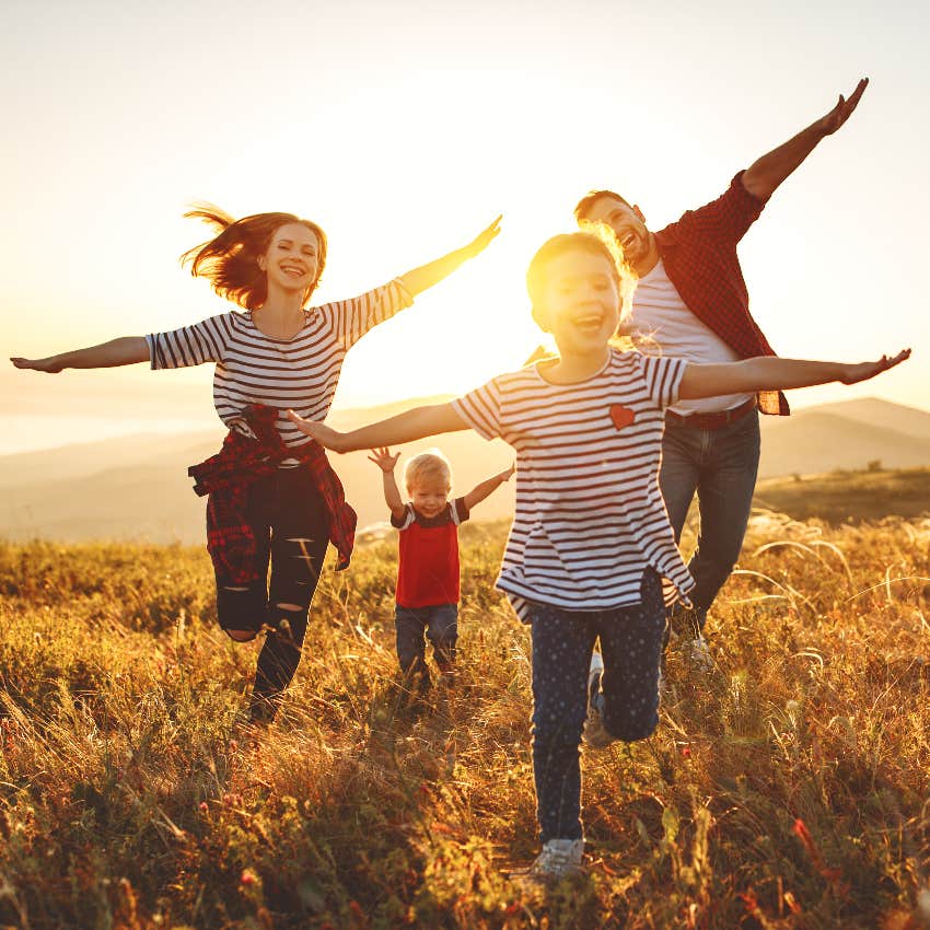 Happy family playing outside