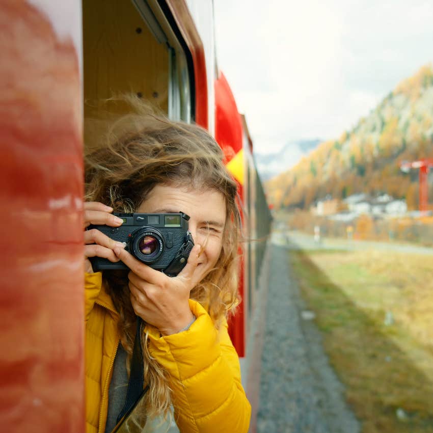 Happy woman taking photos