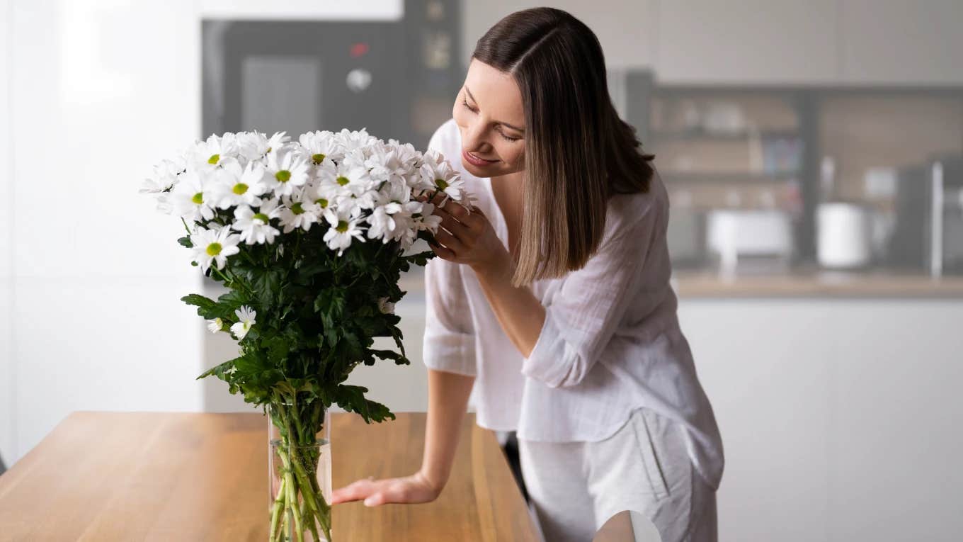 Woman smelling mother's day flowers