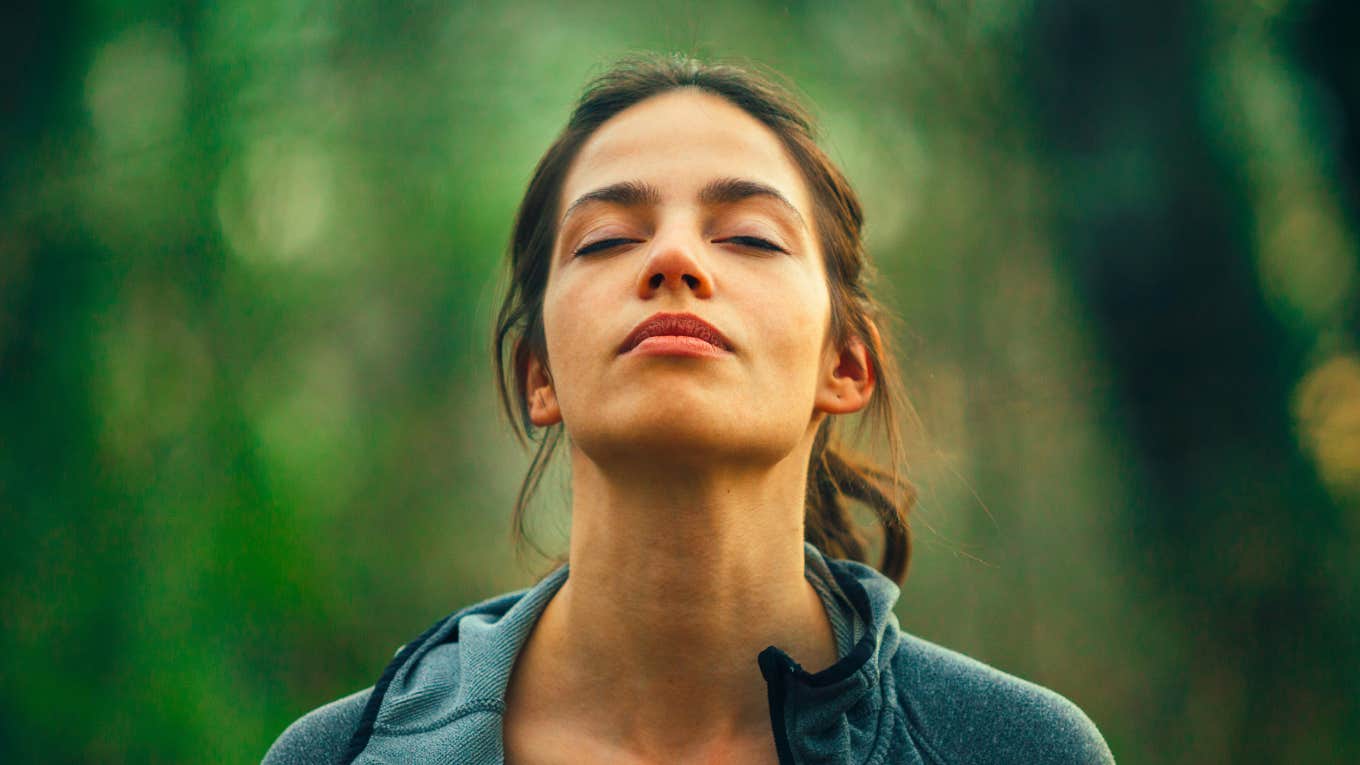 peaceful woman taking a deep breath