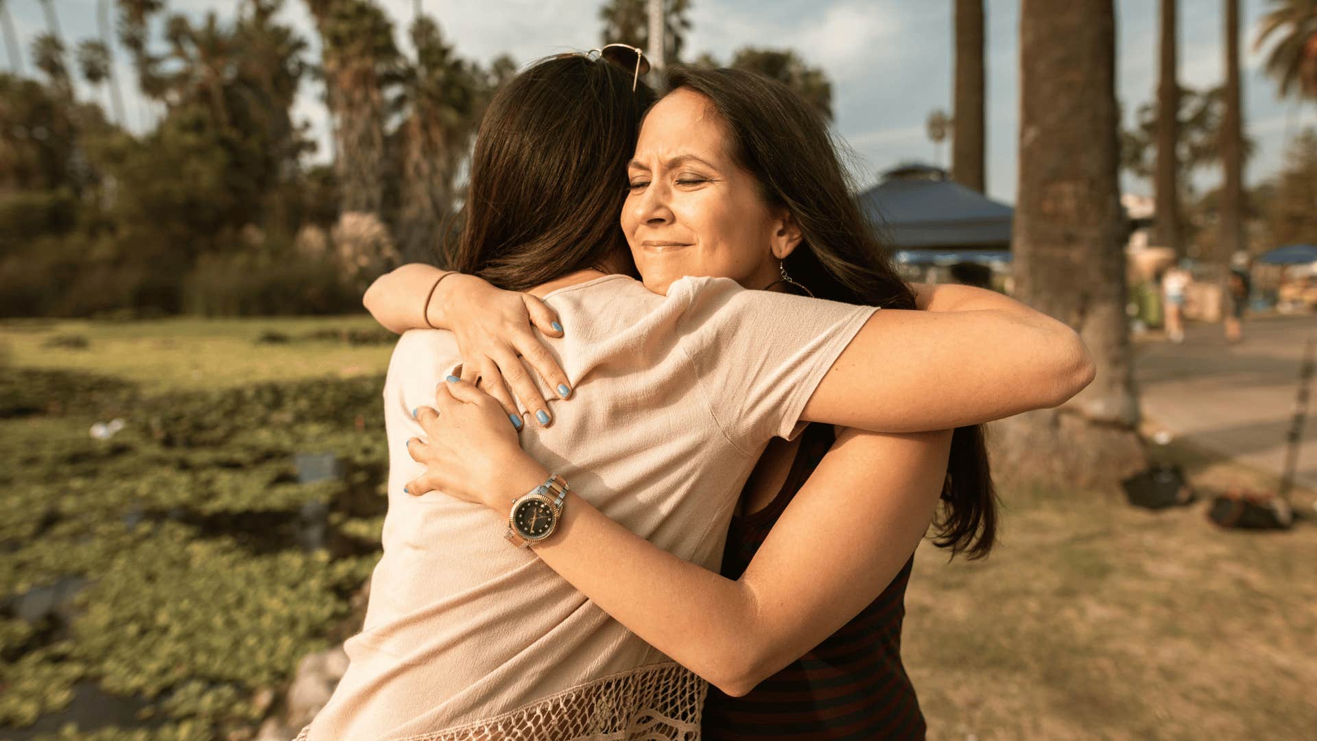 women under thirty eight embracing outside 