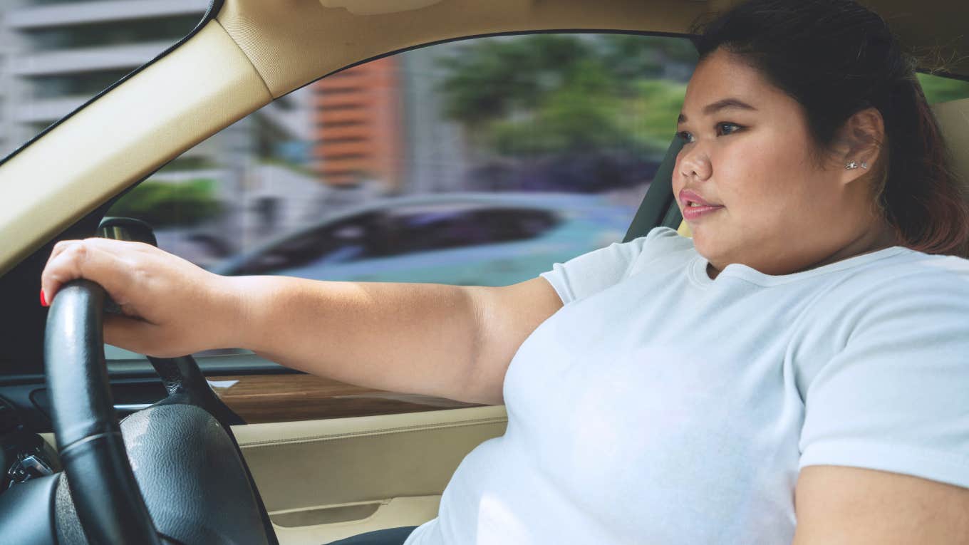 fat woman driving a car