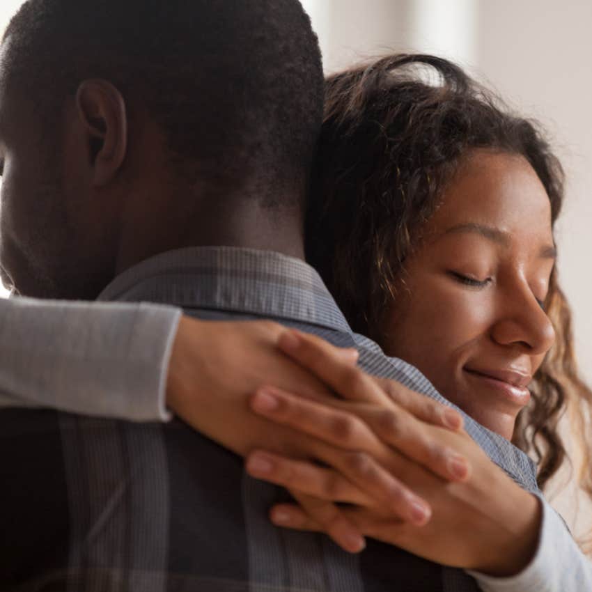 man supporting woman