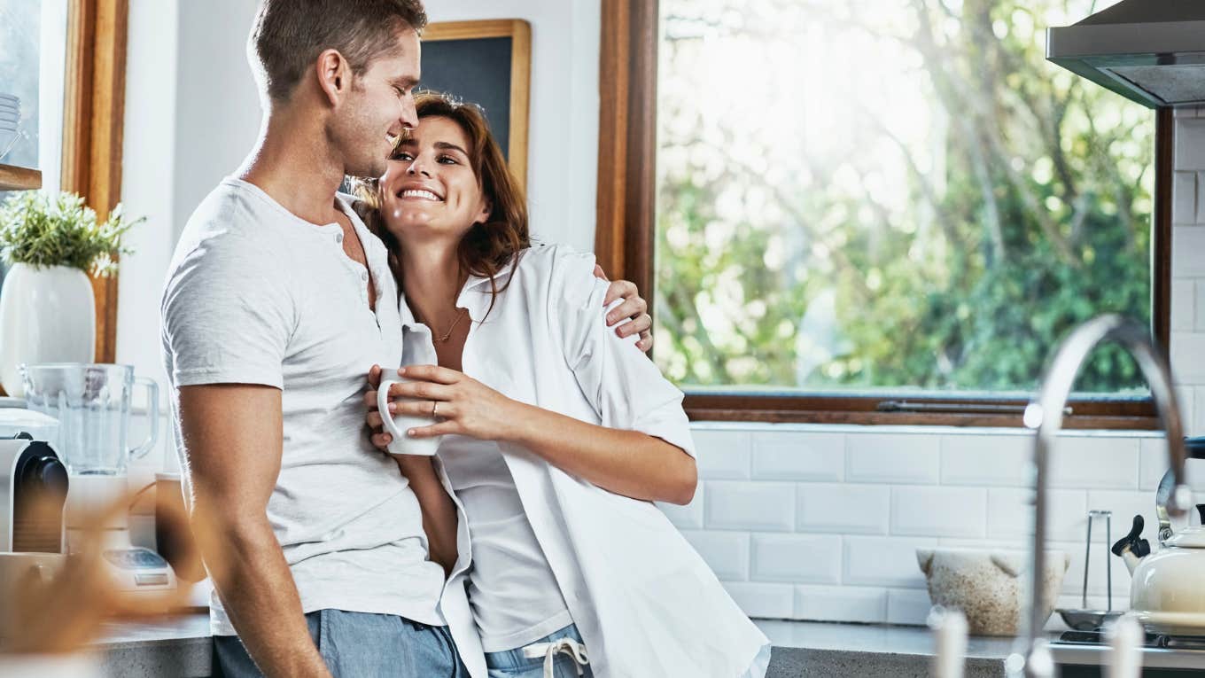 couple hugging in the kitchen