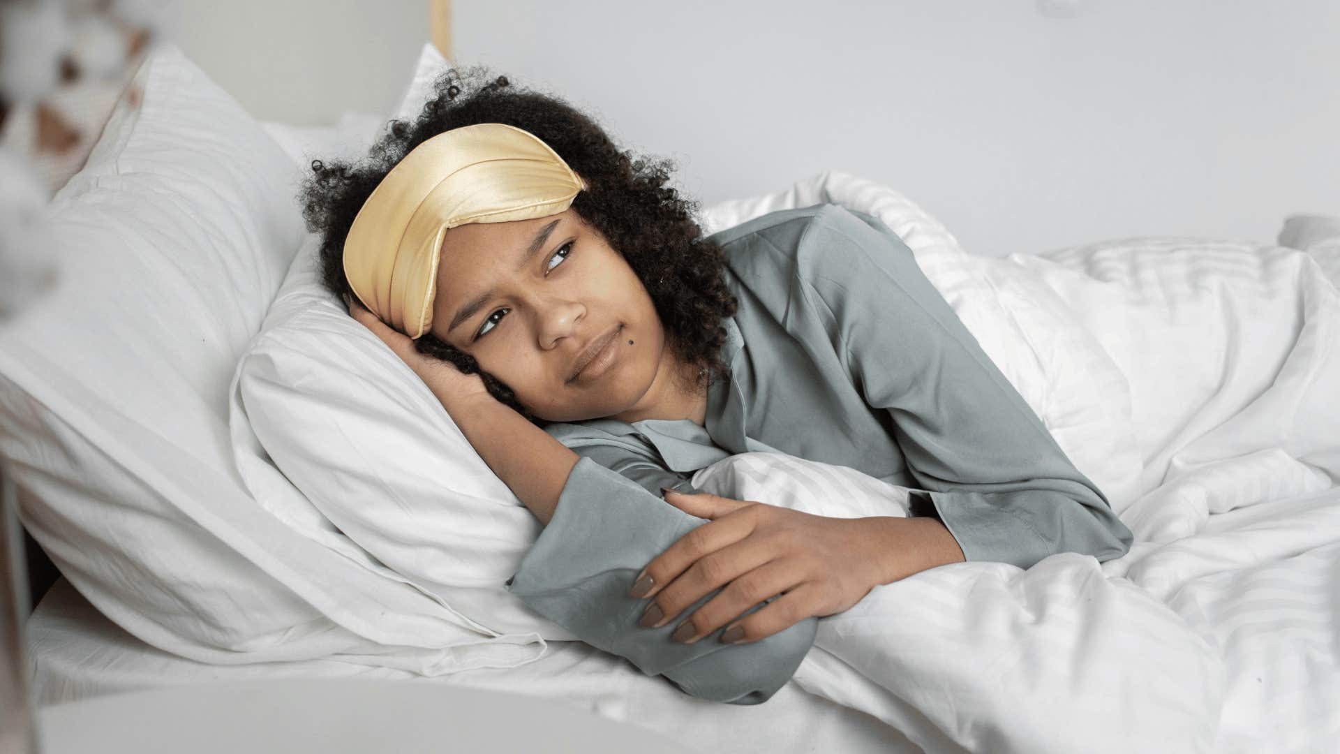 woman thinking while in bed