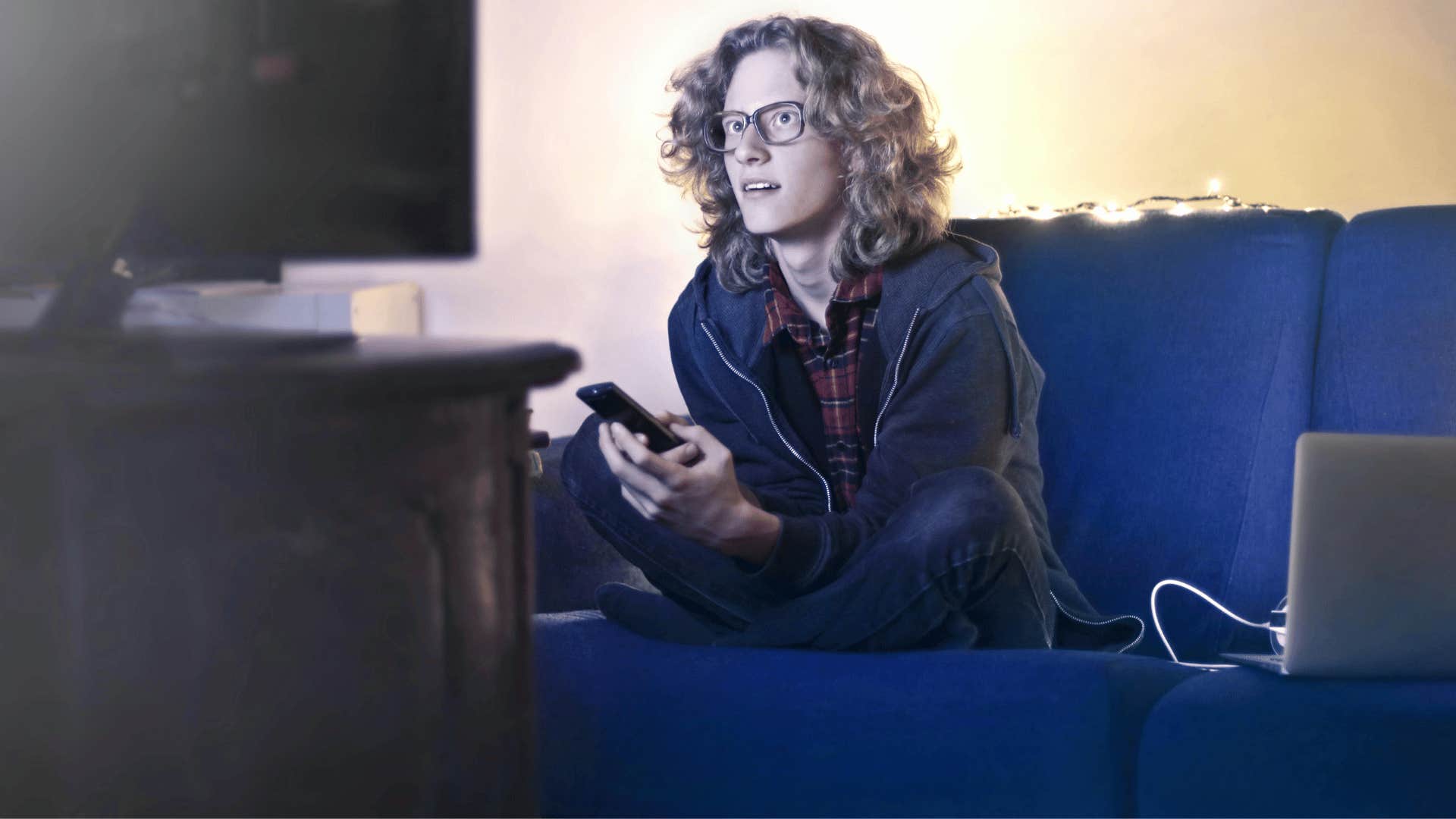 man watching videos on a television