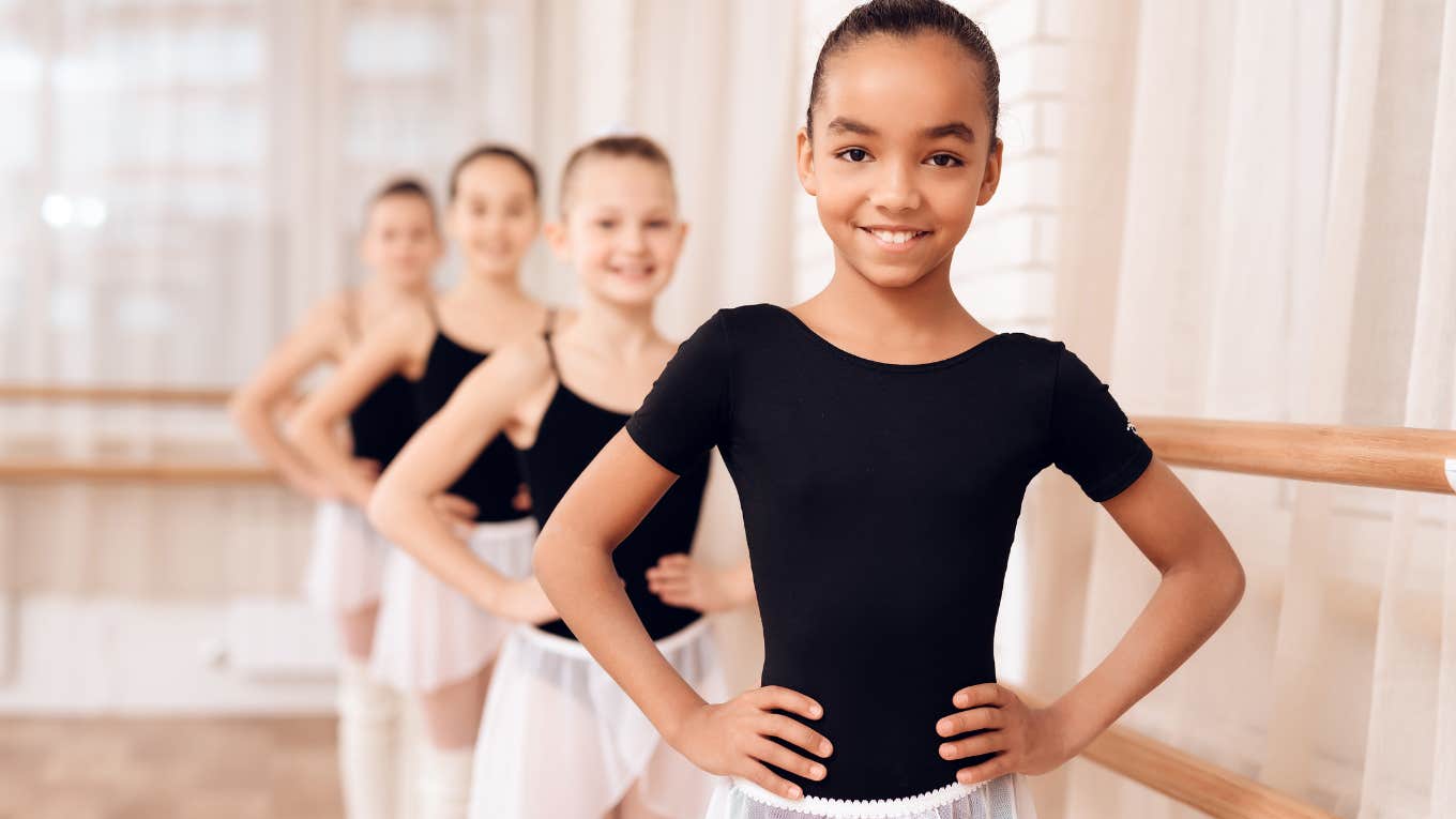 Little dancers smiling for a photo in class. 