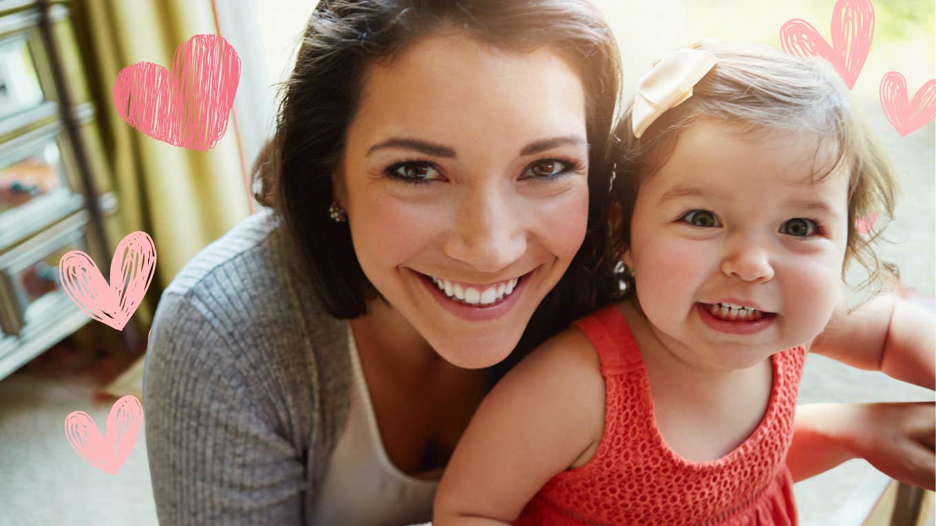 Mom taking care of herself and her kid, smiling 