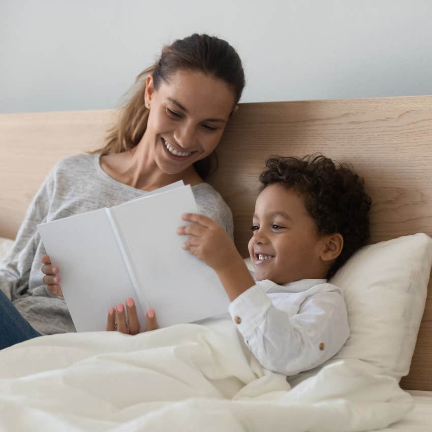 Mom reading with son in bed