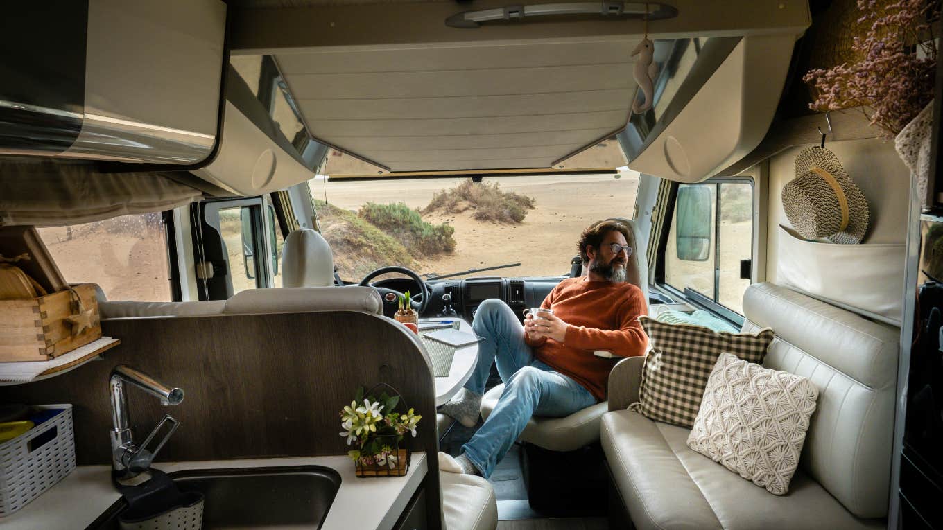 man sitting in a camper 