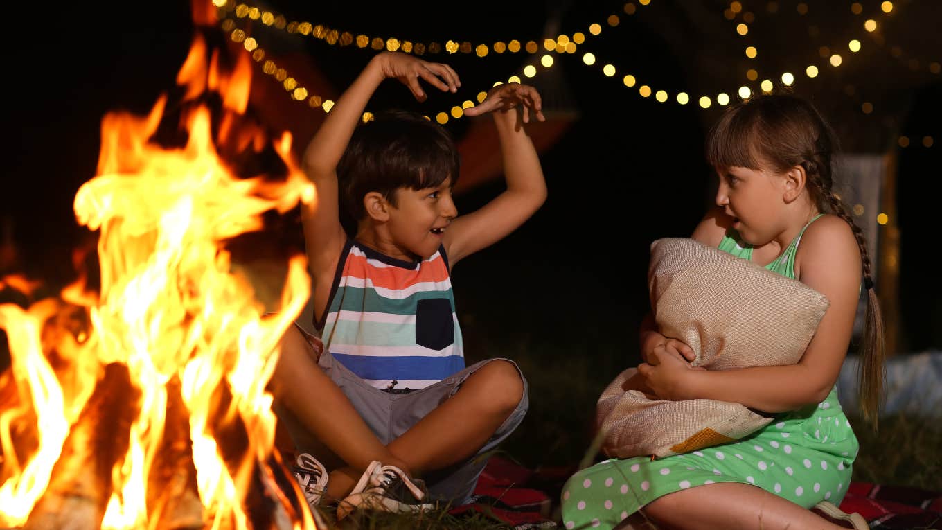 kids telling scary stories around a campfire