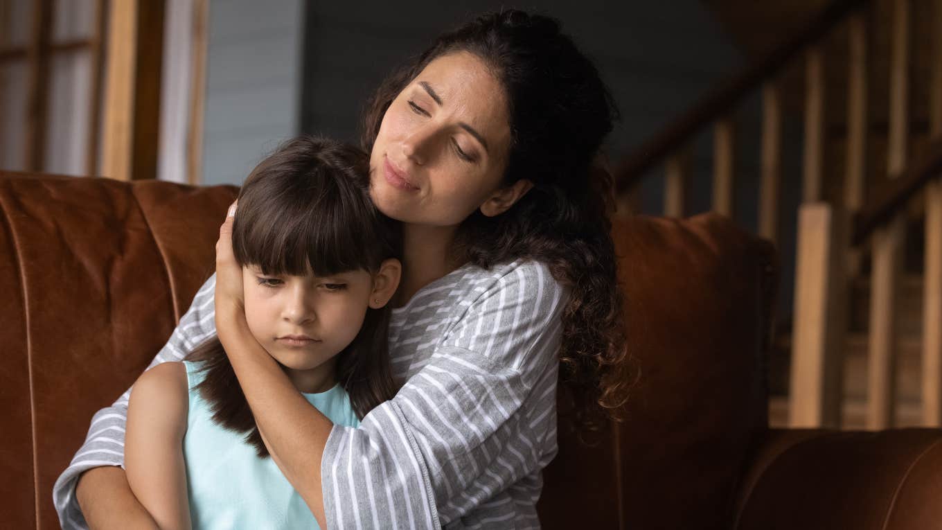 mom hugging her daughter