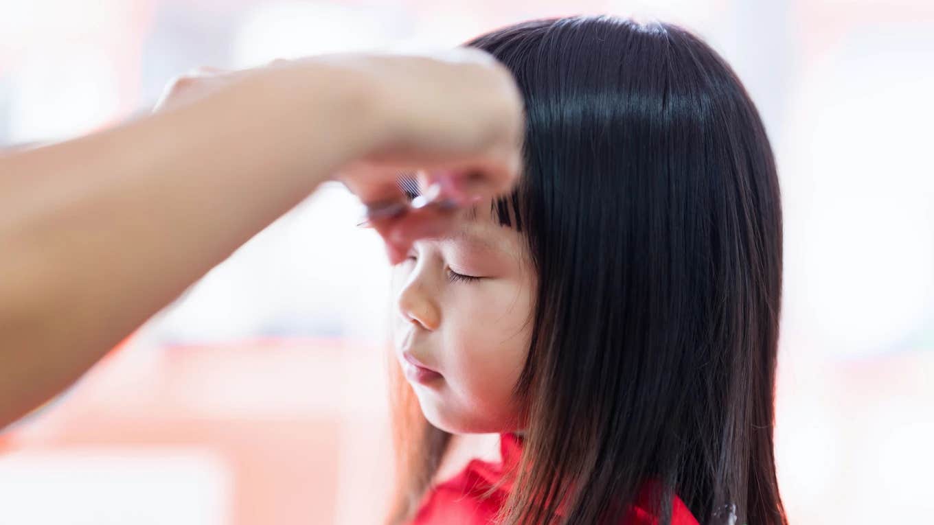 Daughter's bangs being cut by baby daddy's new girlfriend