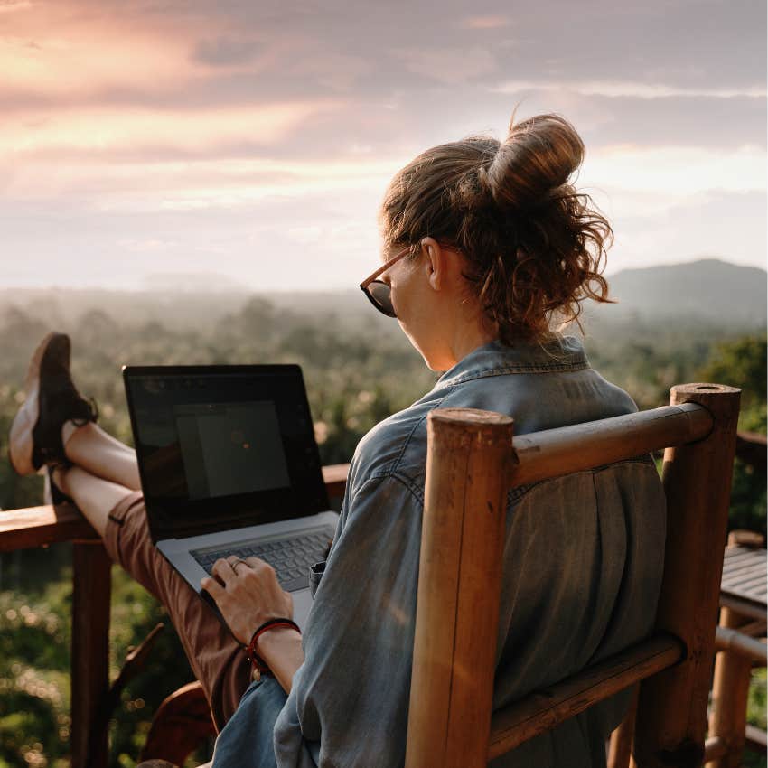 woman working on laptop outside